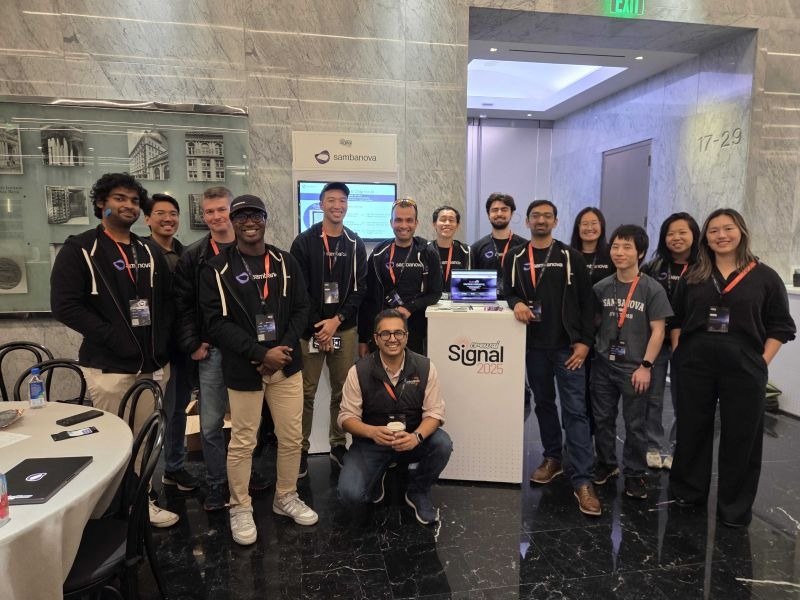 A group gathered beside the event sign at CrewAI’s Signals conference.