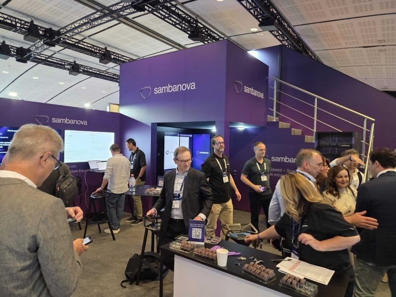 Visitors at the SambaNova booth at RAISE Summit in Paris.